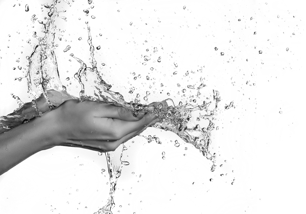 Woman hand in water splash